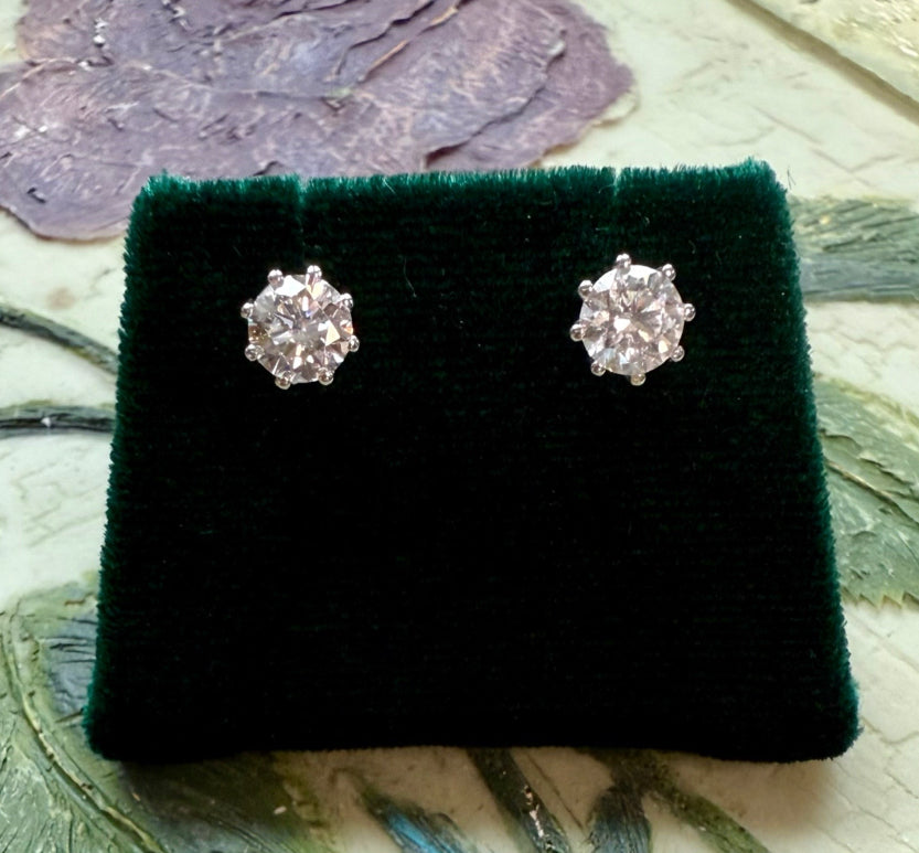 Round brilliant cut lab diamond studs .50 carat weight each totaling 1 Carat are cradled beautifully in an intricate 6 prong setting complementing the sparkling facets of a round diamond. This item is a must have staple. 14K white gold 14K rose gold 14K yellow gold. screw backs