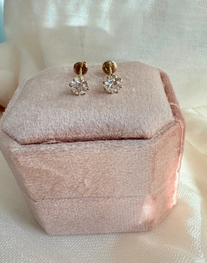 Round brilliant cut lab diamond studs .50 carat weight each totaling 1 Carat are cradled beautifully in an intricate 6 prong setting complementing the sparkling facets of a round diamond. This item is a must have staple. 14K white gold 14K rose gold 14K yellow gold. screw backs 
